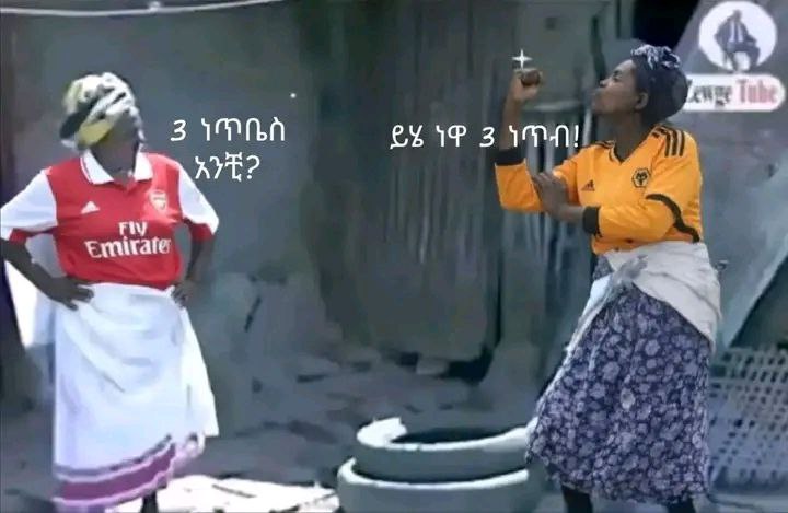 two women are dancing in the street